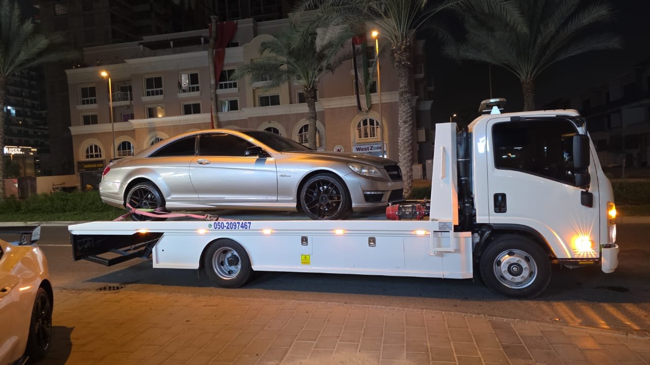 Luxury car recovery Dubai — Mercedes CL night flatbed